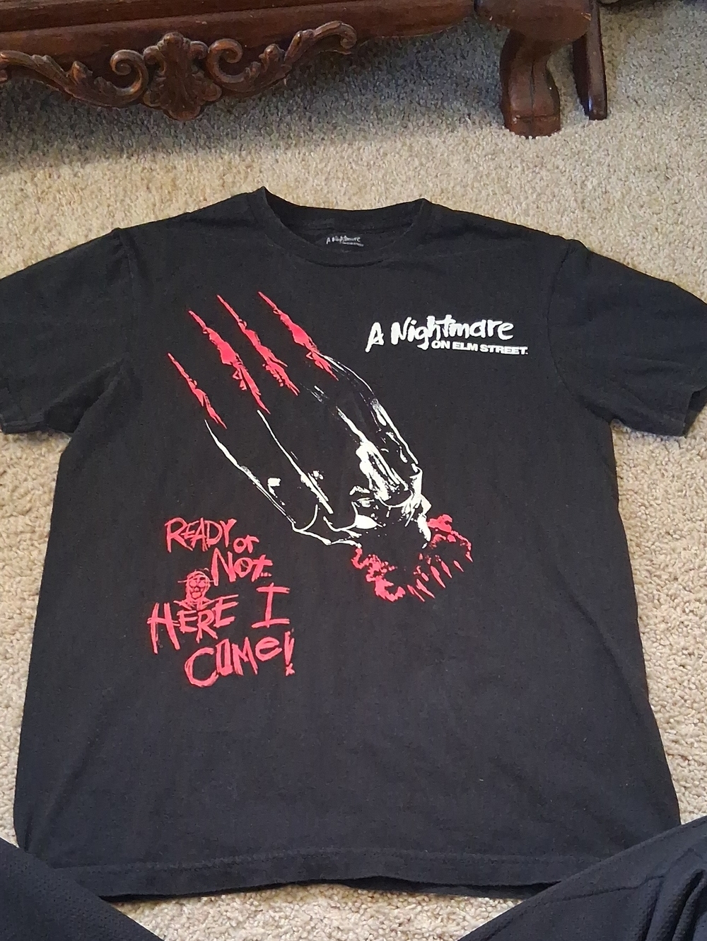 A Nightmare on Elm Street Black Graphic Tee with Red Accents
